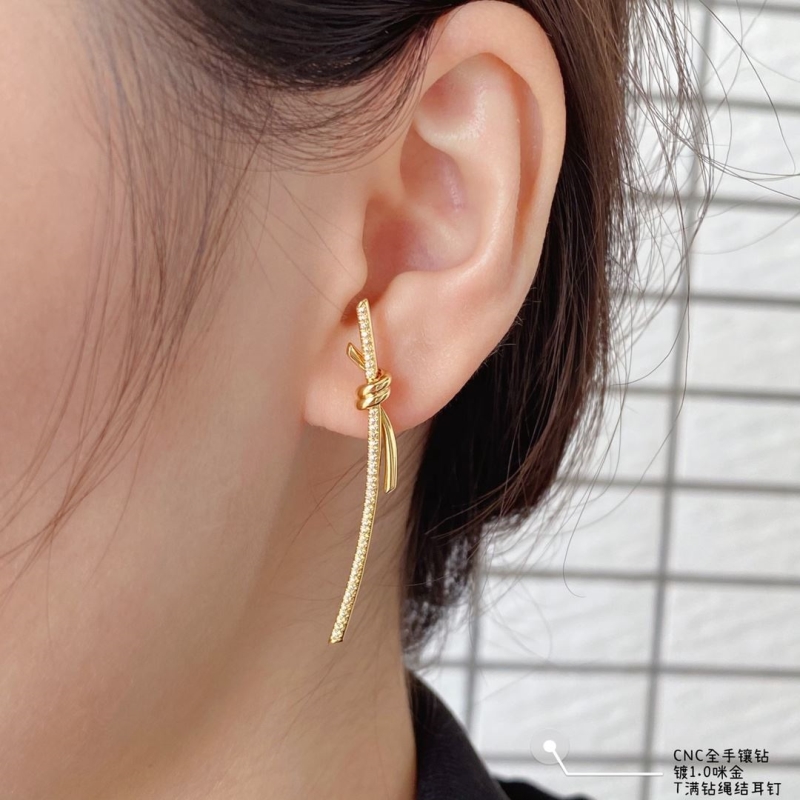 T*f*ny earrings